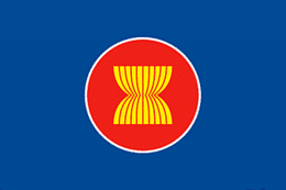 Bandiera dell'Associazione Nazioni del Sud Est Asiatico: fondo blu, al centro c'è un cerchio arancione dal bordo bianco. All'interno del cerchio delle strisce gialle formano una sorta di clessidra