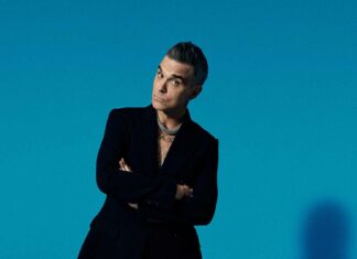 Robbie Williams ha un sogno nel cassetto: aprire i concerti degli Oasis